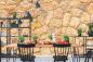 Preview: Steinoptik Fototapete mit einer mediterranen Steinmauer