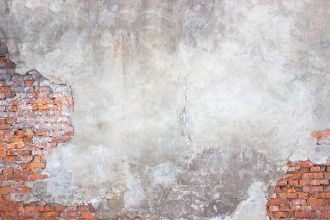 Fototapete Steinmauer mit bröckelndem Putz