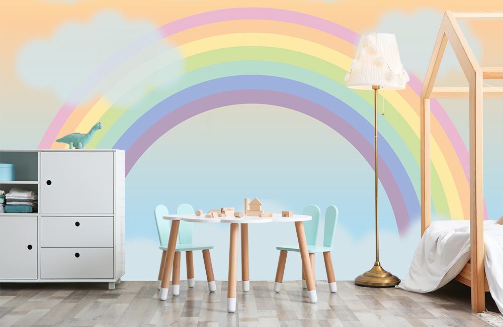 Fototapete mit einem Regenbogen in Pastellfarben in einem Kinderzimmer